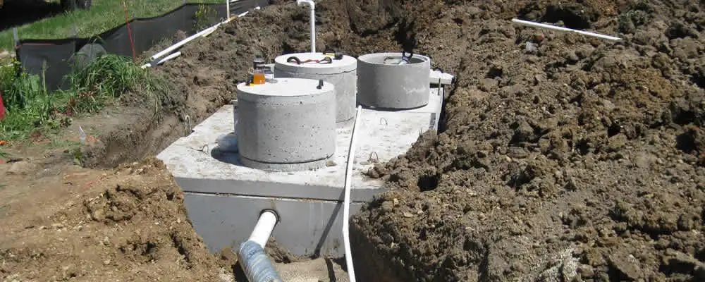 Septic system repair and installation site with tank access ports in Buffalo, NY